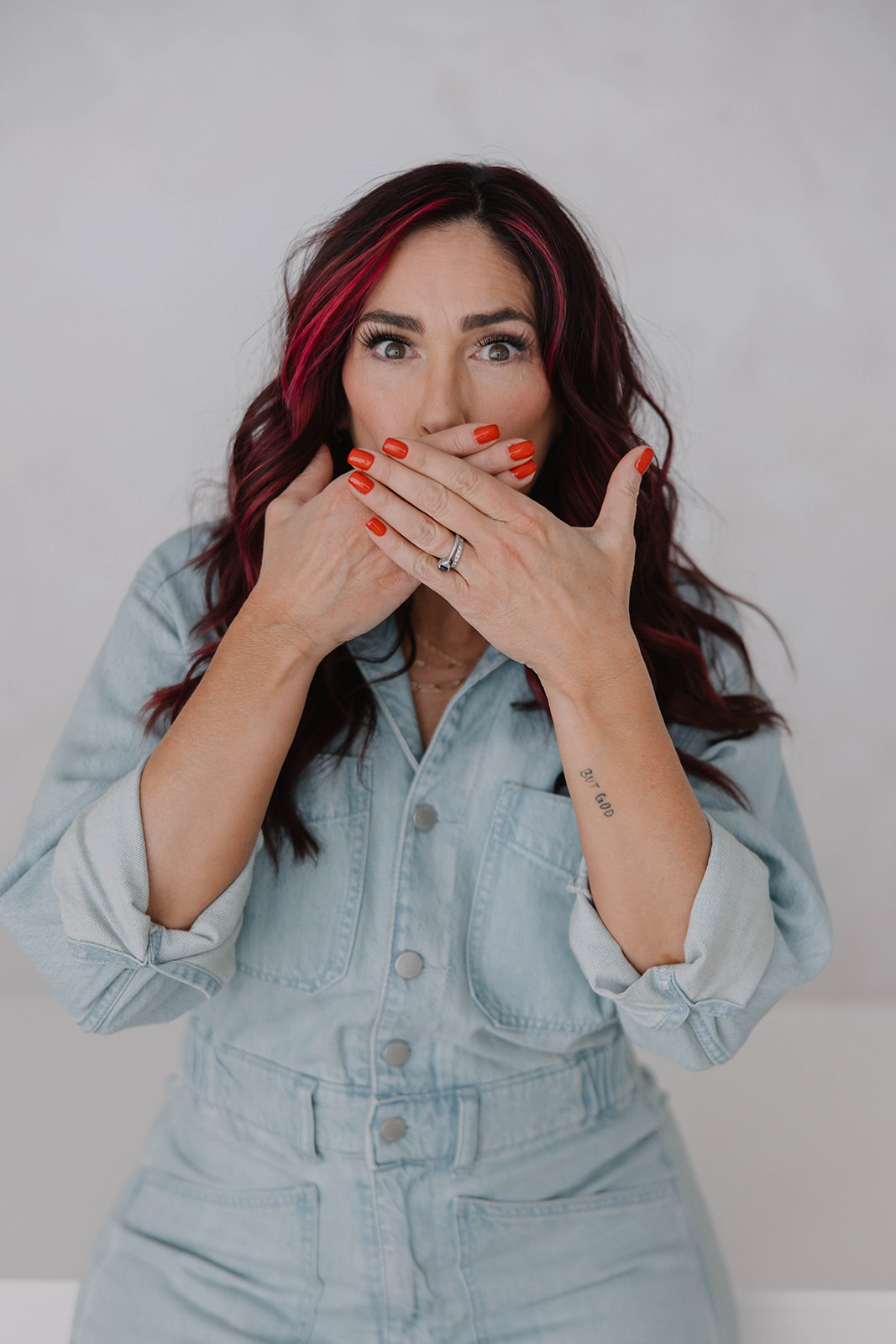 Michelle — hands clamped over mouth, wide eyes